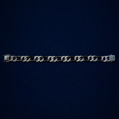 A top-down view of Effortless Edge bracelet on a dark navy background, displaying the rhythmic architectural design.