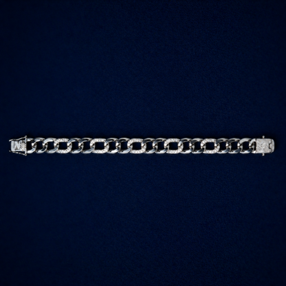 A full-length top-down view of the Effortless Edge bracelet on a dark navy background, displaying the rhythmic pattern of polished and stone-encrusted silver links.