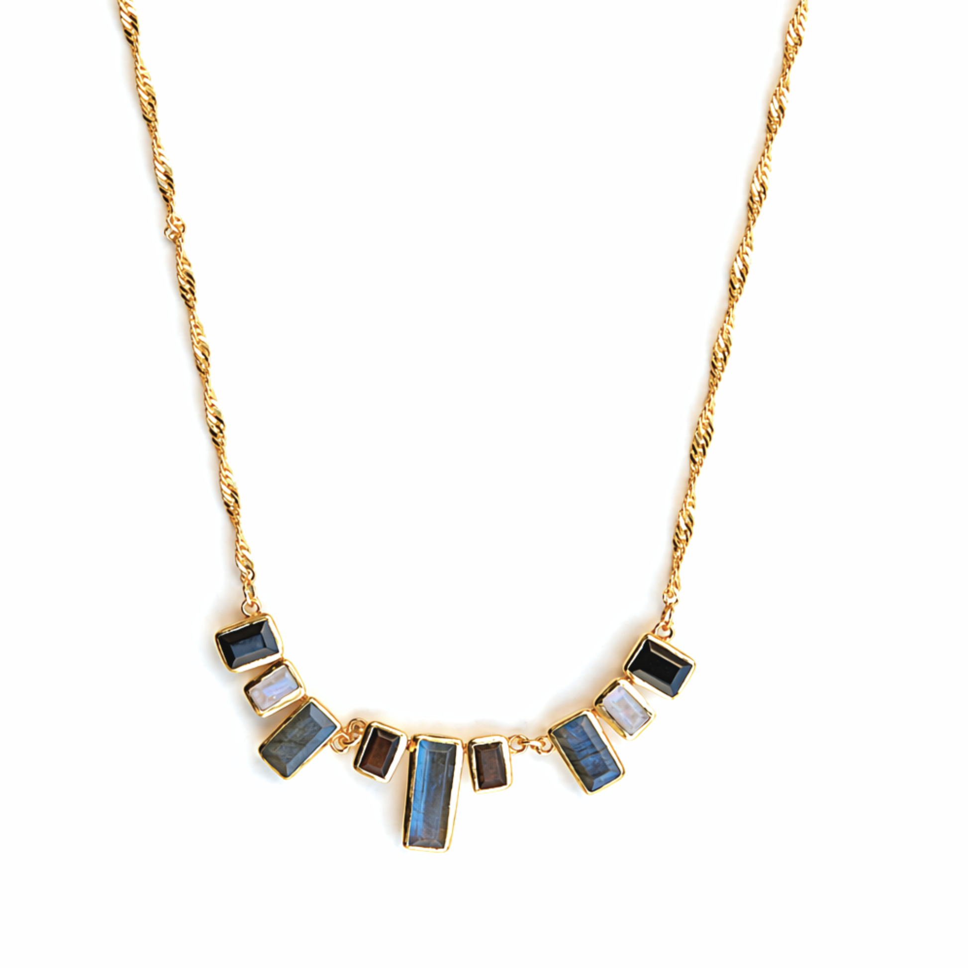 Frontal studio view of the A Story of Stones necklace, displaying the balanced arrangement of rectangular black onyx, moonstone, and labradorite links in a polished gold setting.