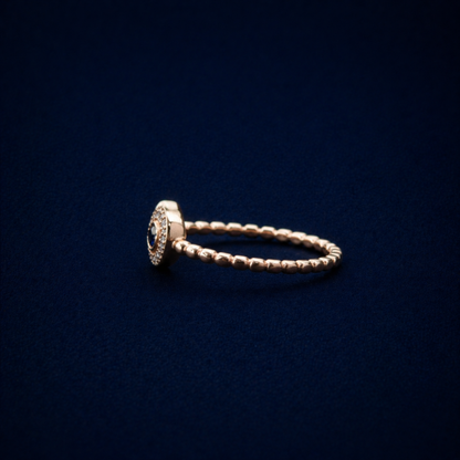 Side profile of the A Little Love Ring showcasing the delicate beaded texture of the adjustable band and the raised heart-shaped cubic zirconia setting.