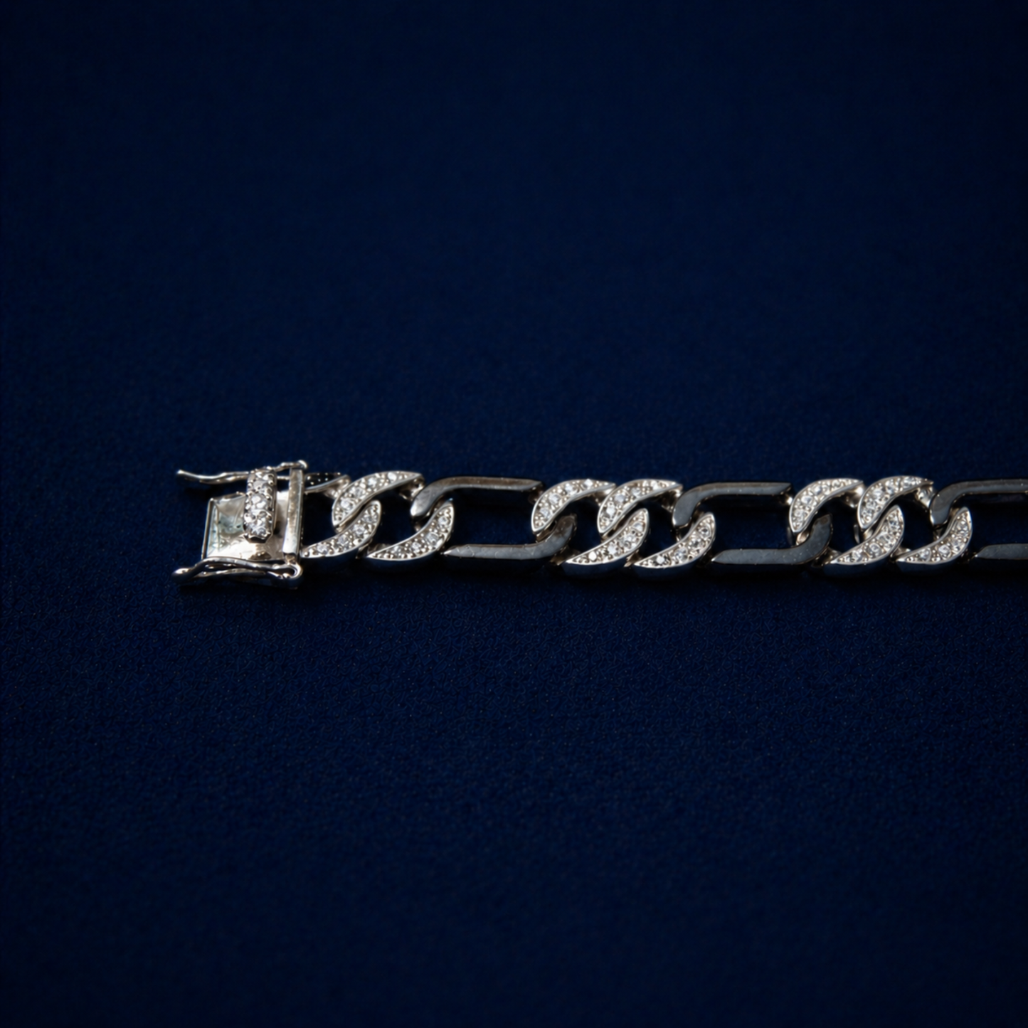 Close-up of the Effortless Edge bracelet focusing on the high-security box clasp and the meticulous pavé setting of clear cubic zirconia stones on the substantial  links.