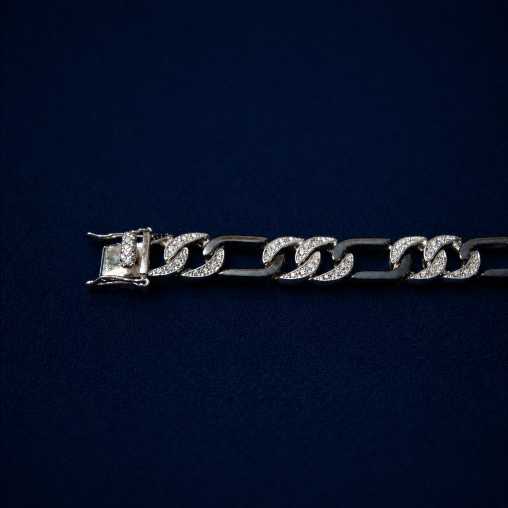 Close-up of the Effortless Edge bracelet focusing on the high-security box clasp and the meticulous pavé setting of clear cubic zirconia stones on the substantial  links.