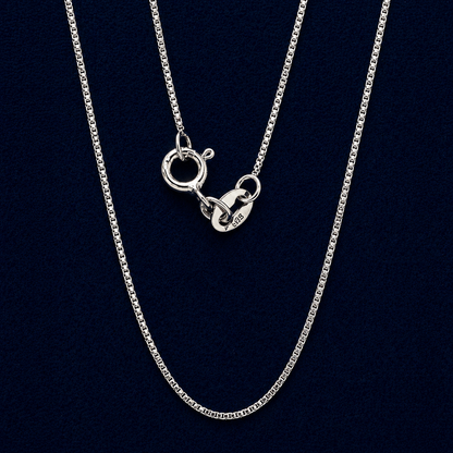 A neat and structured 925 sterling silver box link chain necklace displayed to show its fluid movement and polished finish, perfect for minimalist styling.