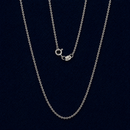 Elegant 925 sterling silver stackable necklace with a slim cable chain and modern hoop lock detail, displayed against a dark navy background.