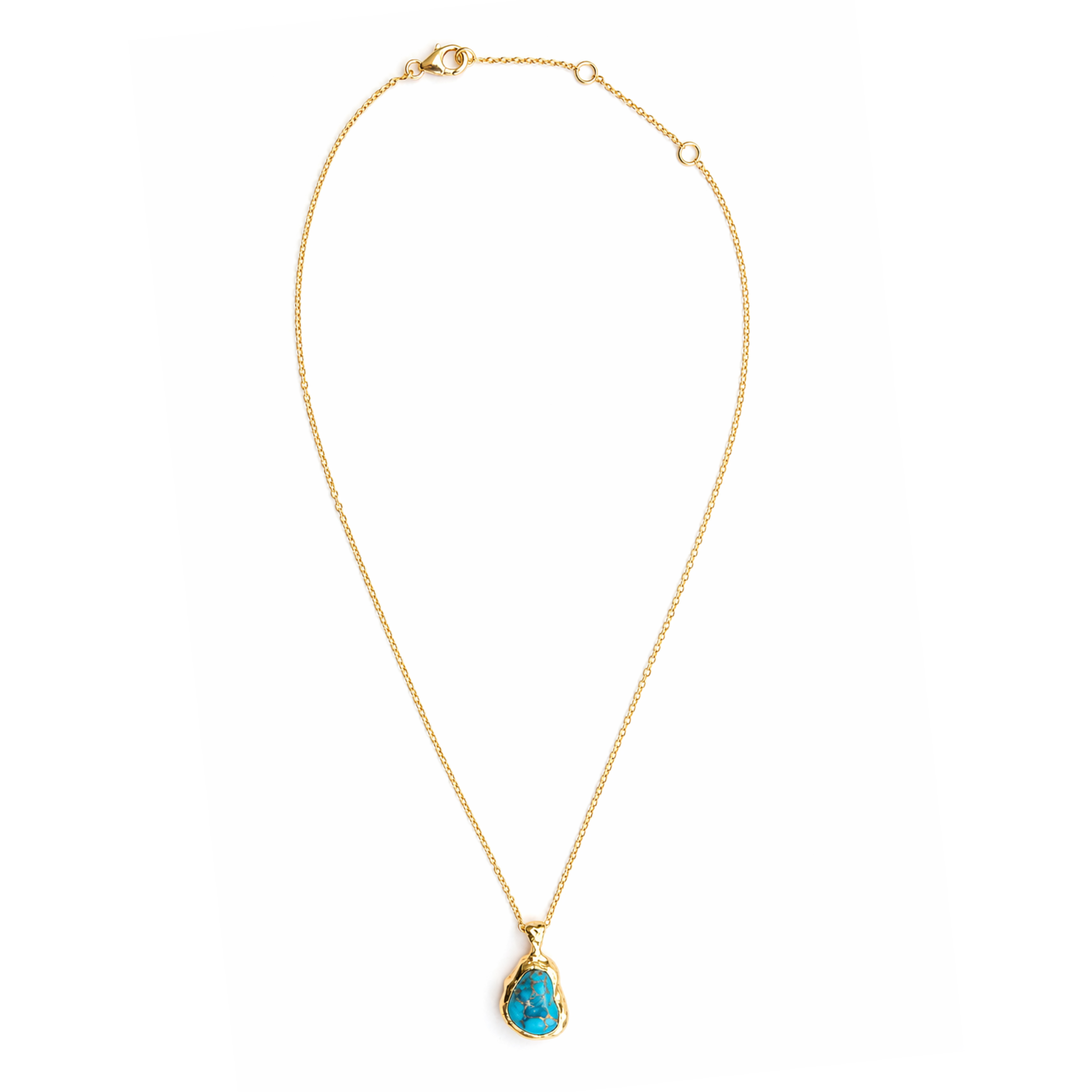 ull studio shot of the Earthy Charm necklace on a white background, displaying the artisanal copper turquoise pendant and the adjustable 18kt gold plated 925 sterling silver chain.