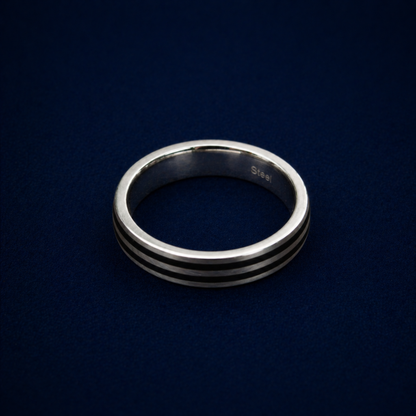 An angled shot of the Urban Lines Ring highlighting the two sleek black enamel parallel lines inlaid into a polished sterling silver band for a contemporary, urban look.
