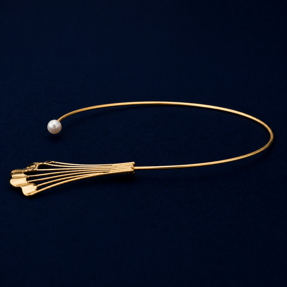 A side perspective of the Soft Glow choker highlighting the sleek, flexible neck cuff design and the polished finish of the modern fan-shaped charm on a dark navy background.