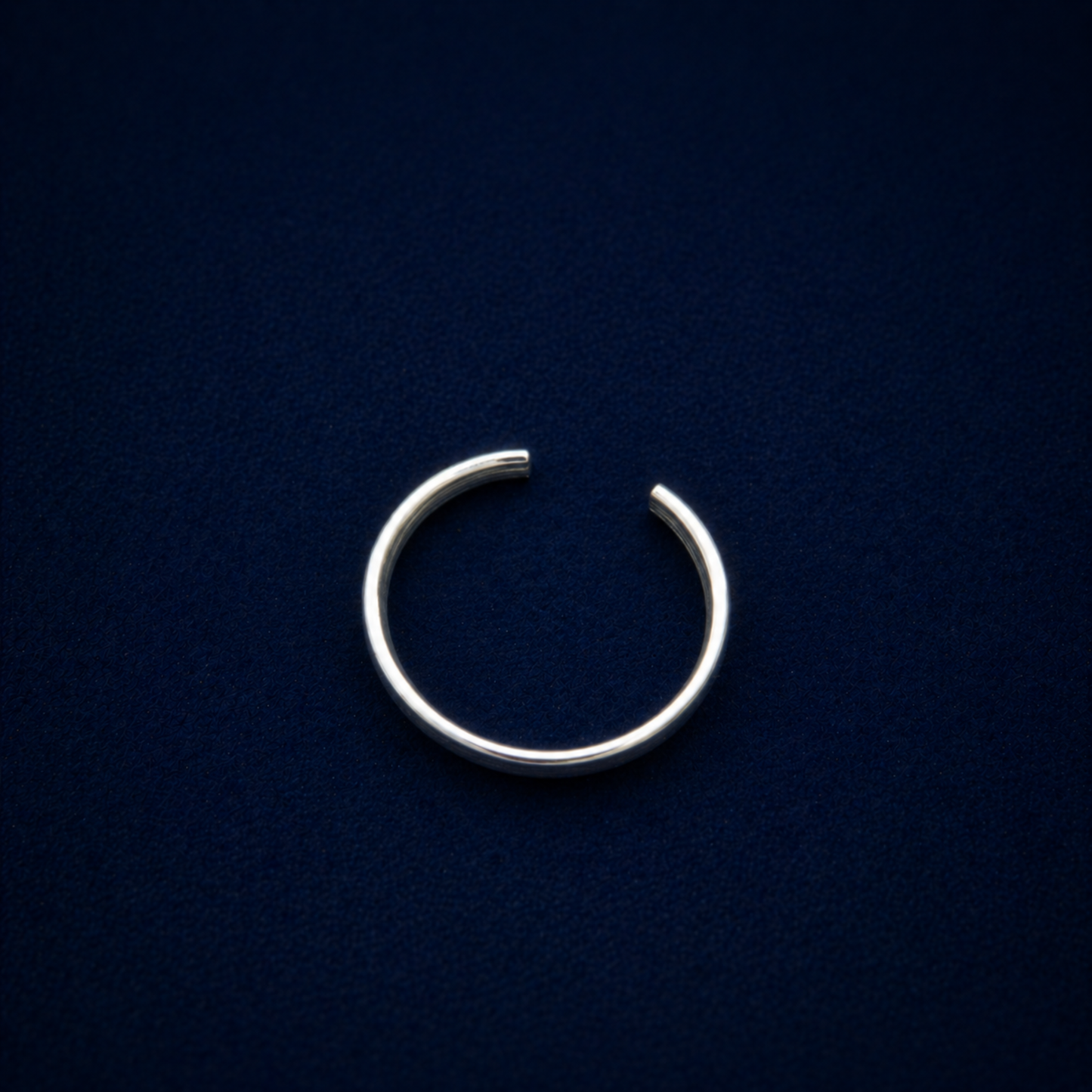 Top-down silhouette of the A Little Statement Ring, highlighting the clean open-back cuff design and sleek 925 silver craftsmanship.