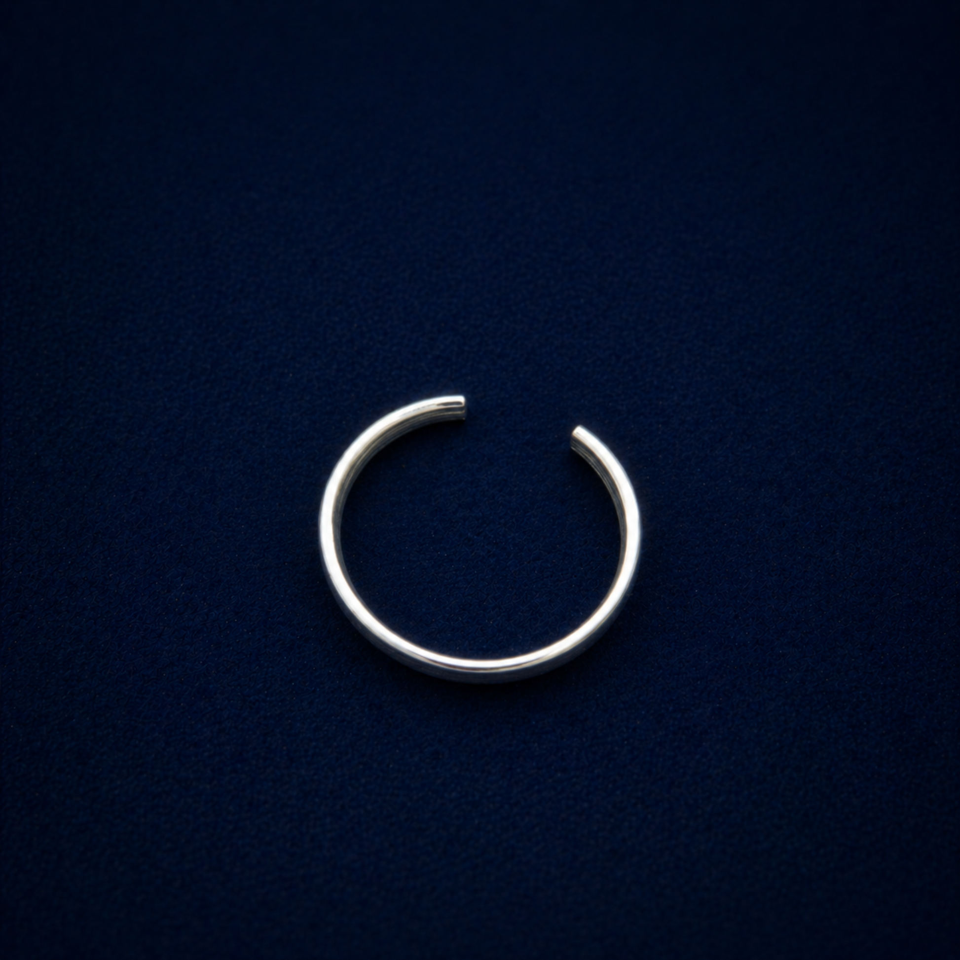 Top-down silhouette of the A Little Statement Ring, highlighting the clean open-back cuff design and sleek 925 silver craftsmanship.