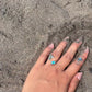 Silver adjustable knuckle ring by Mareeci – worn on hand