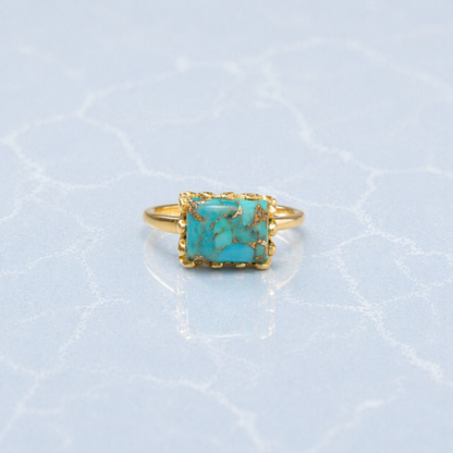 Frontal view of the Earthy Charm Ring showcasing the natural gold-toned matrix patterns in the turquoise stone and the polished minimal gold setting.
