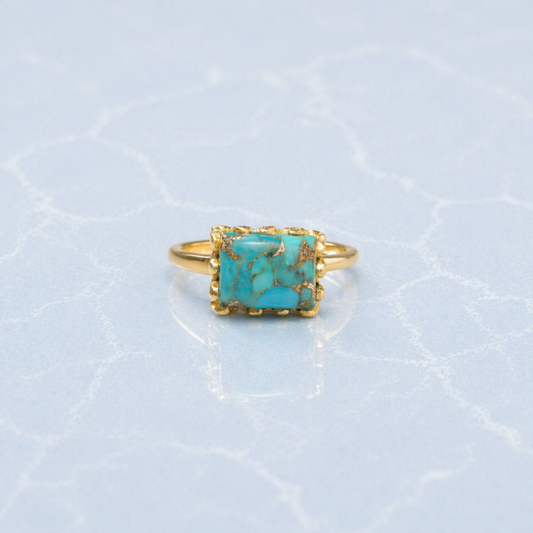 Frontal view of the Earthy Charm Ring showcasing the natural gold-toned matrix patterns in the turquoise stone and the polished minimal gold setting.