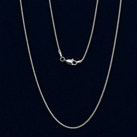 Macro view of a handcrafted 925 sterling silver snake chain necklace, featuring a high-shine lobster clasp and clear 925 authenticity hallmark against a dark navy background.