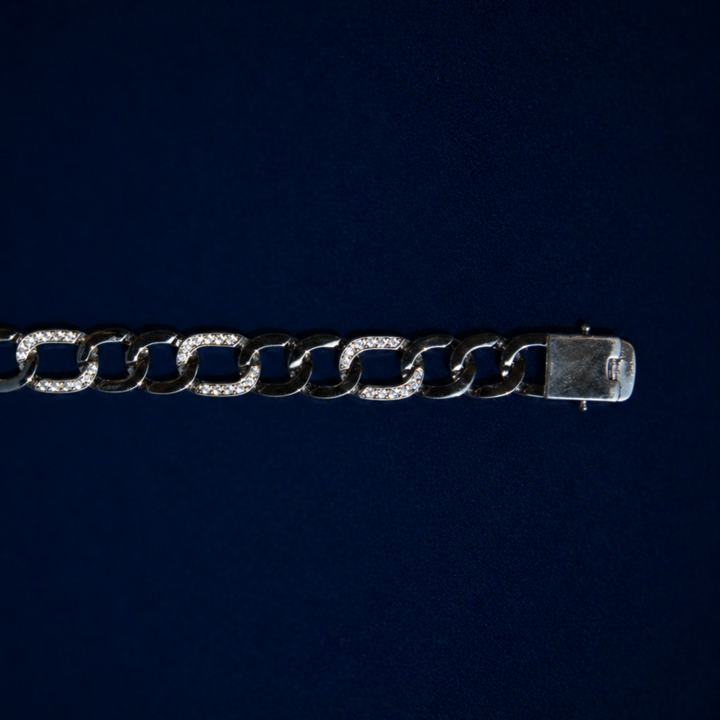 Close-up of the Effortless Edge bracelet focusing on the substantial box clasp and the intricate clear CZ stone settings on the thick sterling silver links.