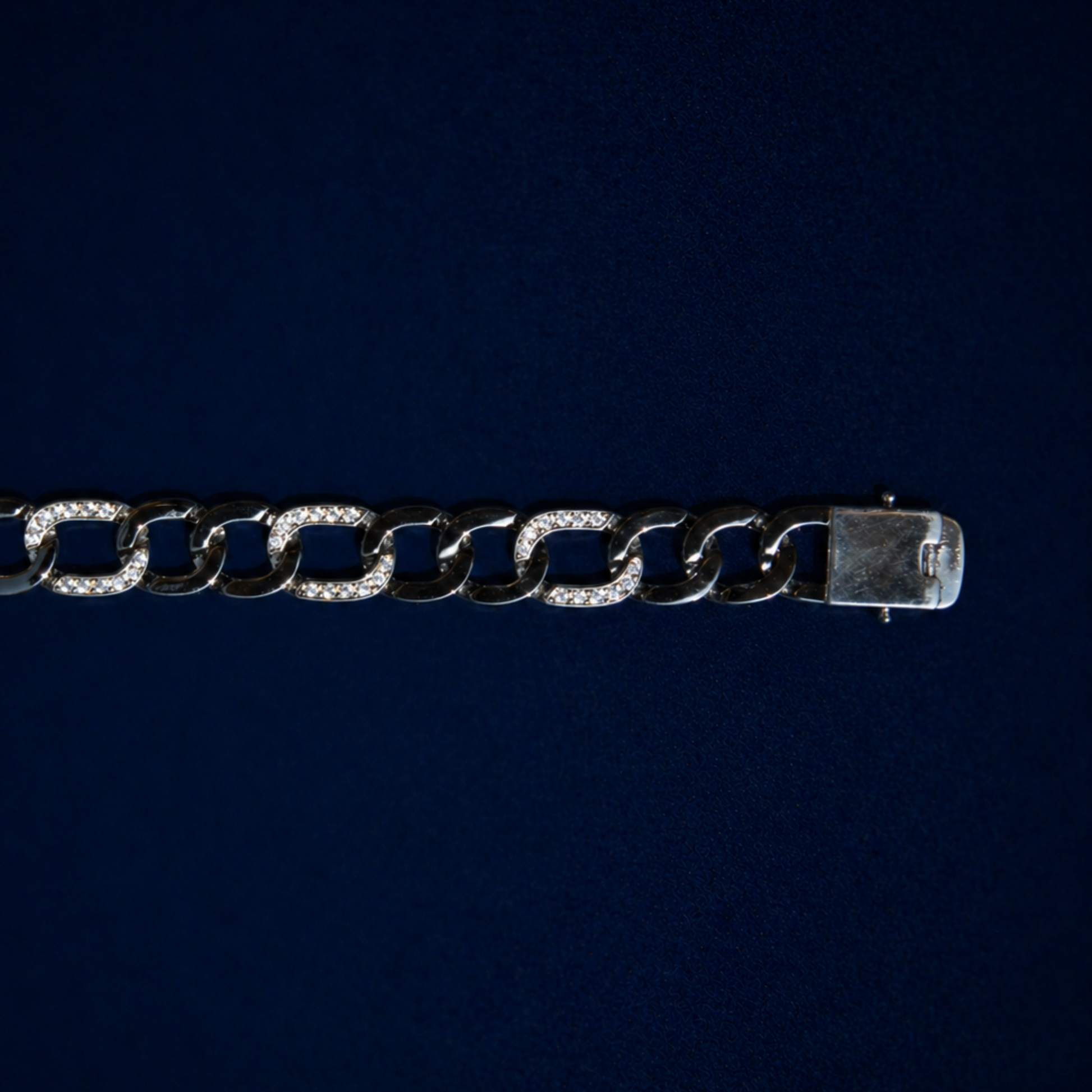 Close-up of the Effortless Edge bracelet focusing on the substantial box clasp and the intricate clear CZ stone settings on the thick sterling silver links.