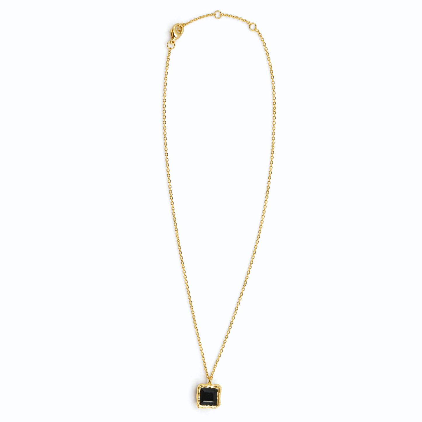 Full studio shot of the Bold Simplicity necklace on a white background, featuring a geometric square black onyx stone and a polished 18kt gold plated 925 sterling silver chain.