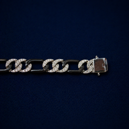 An angled perspective of the Effortless Edge bracelet showcasing the alternating pattern of stone-encrusted and polished black rhodium links for a bold, urban aesthetic.