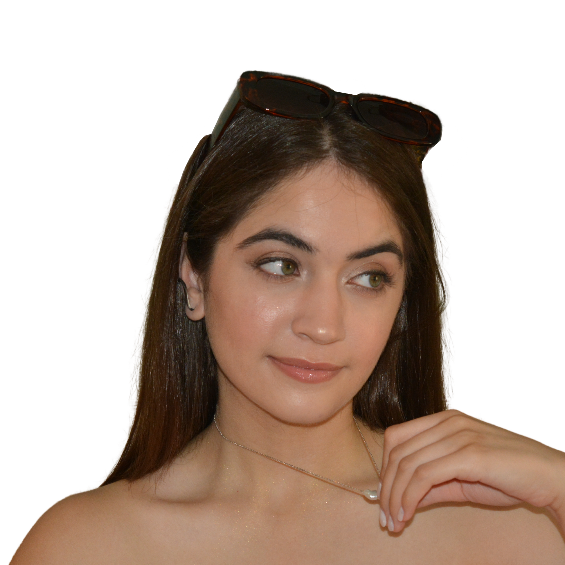 Close-up portrait of a person styled with a high-shine luminous pearl accessory, showcasing its versatile and polished aesthetic.