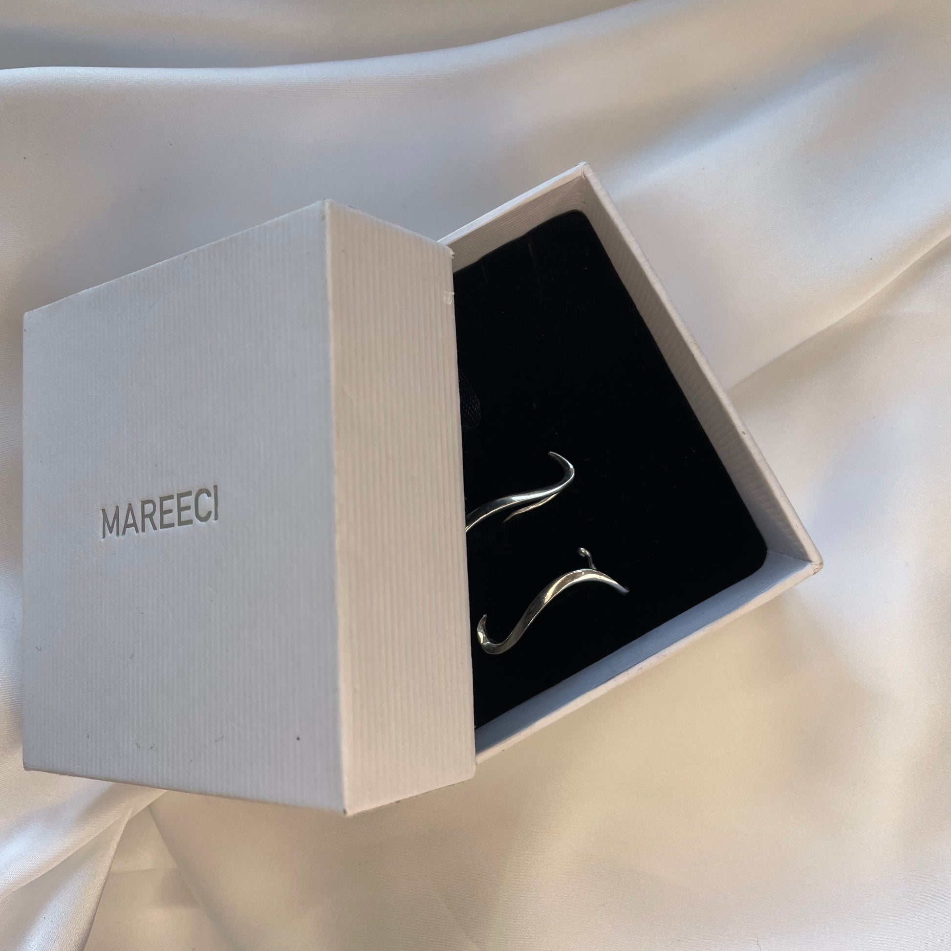 Premium branded jewelry packaging box and a soft velvet storage, ideal for gifting or safe keeping of delicate silver accessories.
