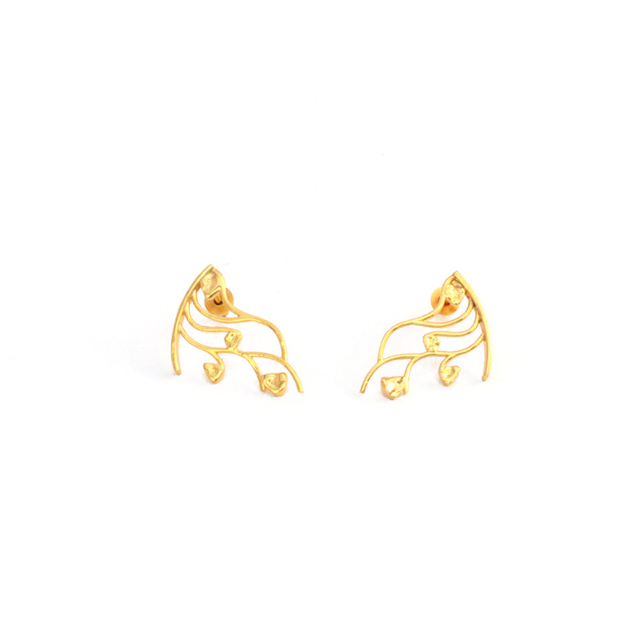 Pair of gold stud earrings featuring an intricate, open-work vine and leaf design on a white background.